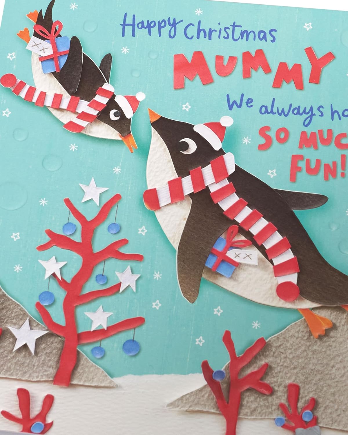 UK Greetings Christmas greeting card for Mummy featuring cute penguins and festive holiday design, ideal for seasonal greetings.