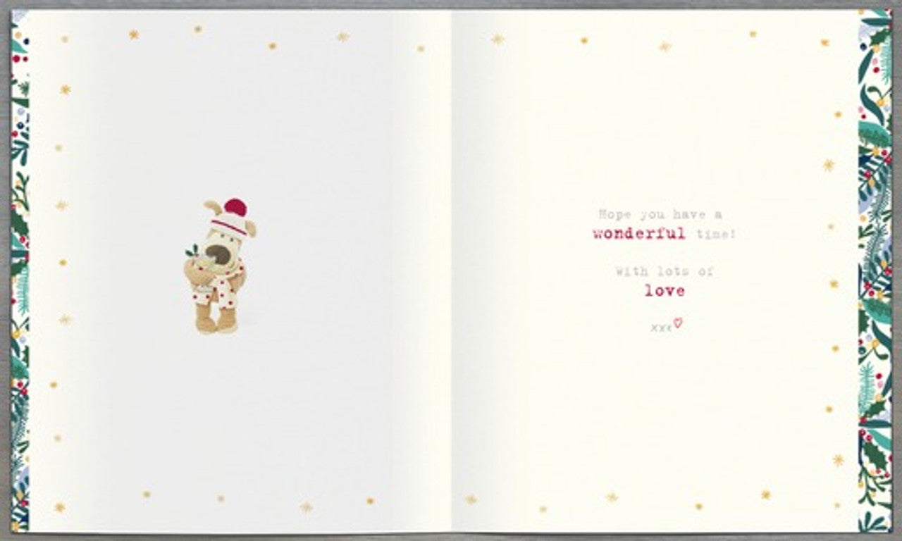 UK Greetings Festive Christmas greeting card featuring Boofle dog holding a cocktail glass design. Bright holiday-themed illustration.