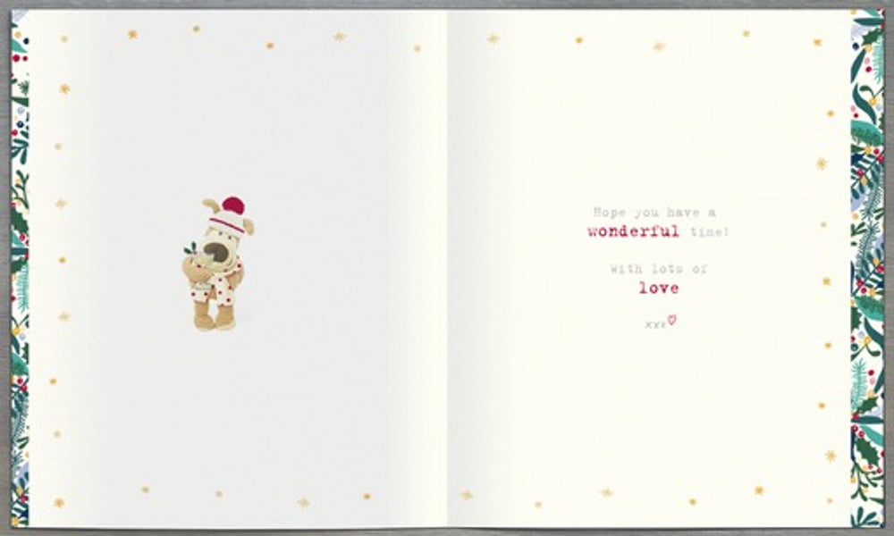 UK Greetings Festive Christmas greeting card featuring Boofle dog holding a cocktail glass design. Bright holiday-themed illustration.