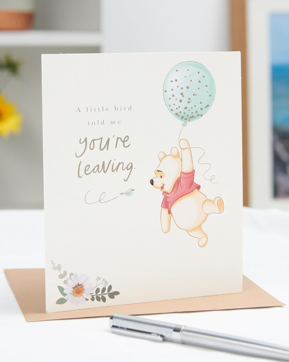 UK Greetings farewell card with heartfelt message for colleagues and friends, featuring colorful floral and farewell design.