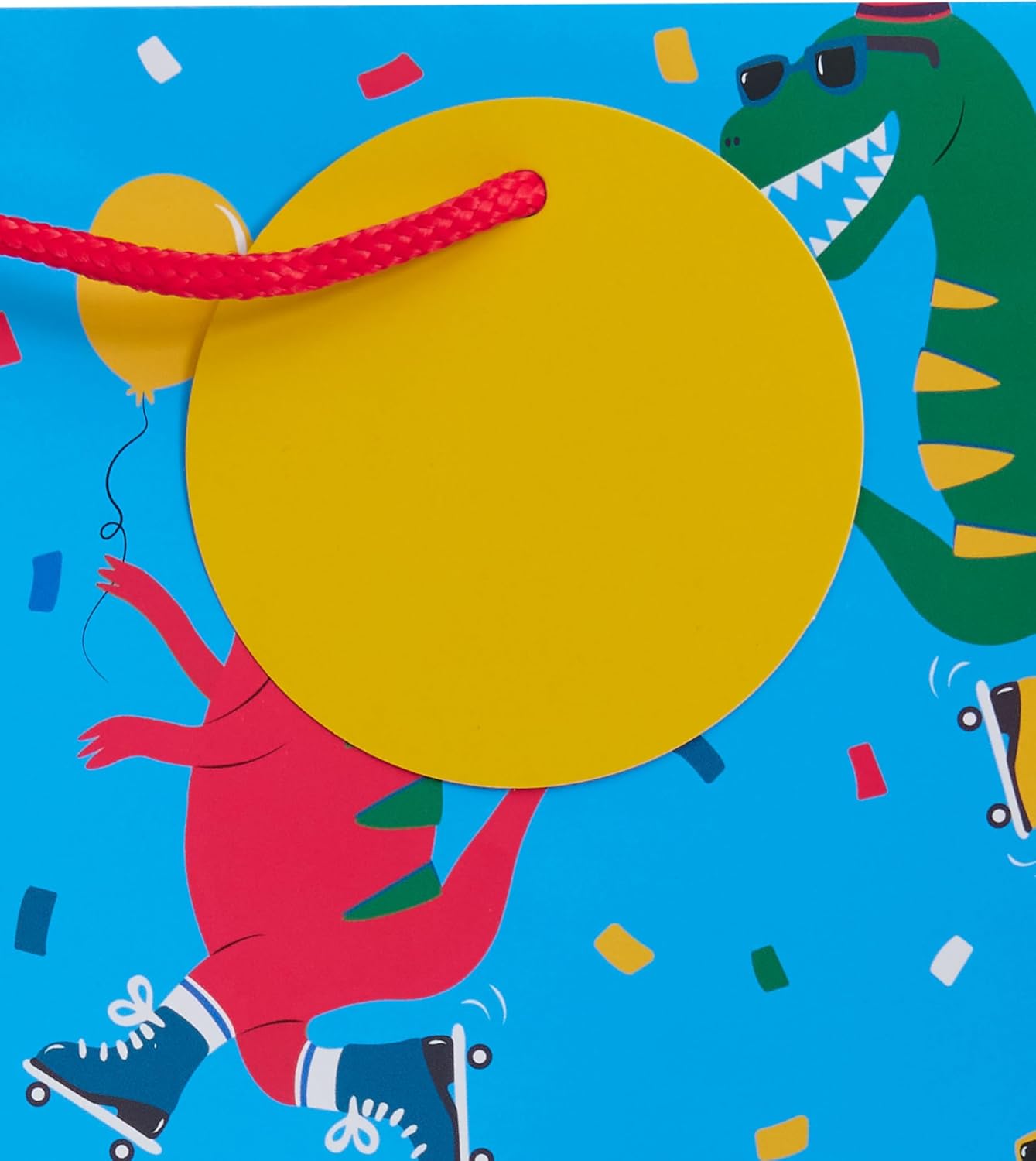 Large UK Greetings gift bag featuring colorful dinosaur design, ideal for party presents and gift-giving occasions.