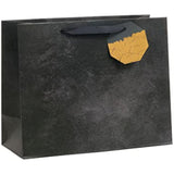 UK Greetings black design large gift bag with sturdy handles, ideal for packaging gifts for special occasions.