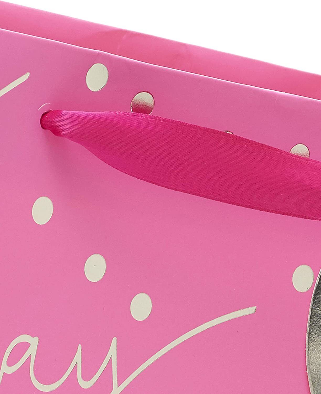 Large pink UK Greetings female birthday gift bag with happy birthday design, suitable for gift giving and celebration.