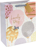 UK Greetings large birthday gift bag with gold foil balloon design, perfect for celebrating special occasions