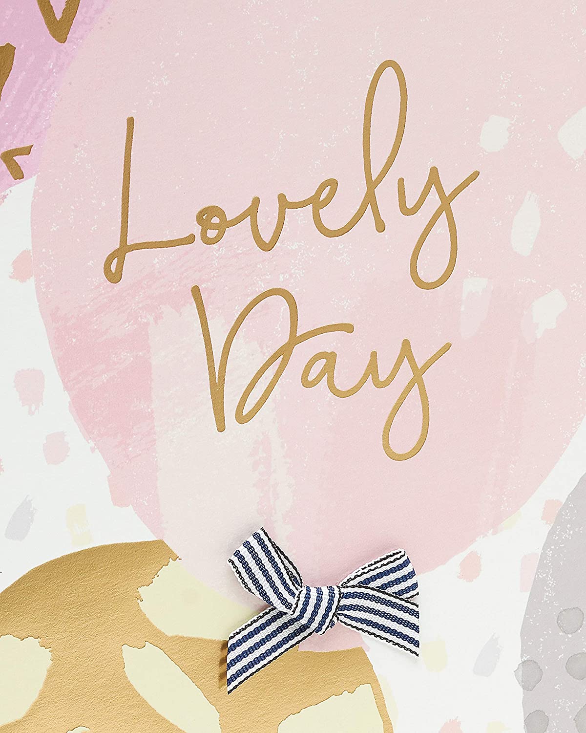 UK Greetings large birthday gift bag with gold foil balloon design, featuring vibrant colors and sturdy handles for special occasions.