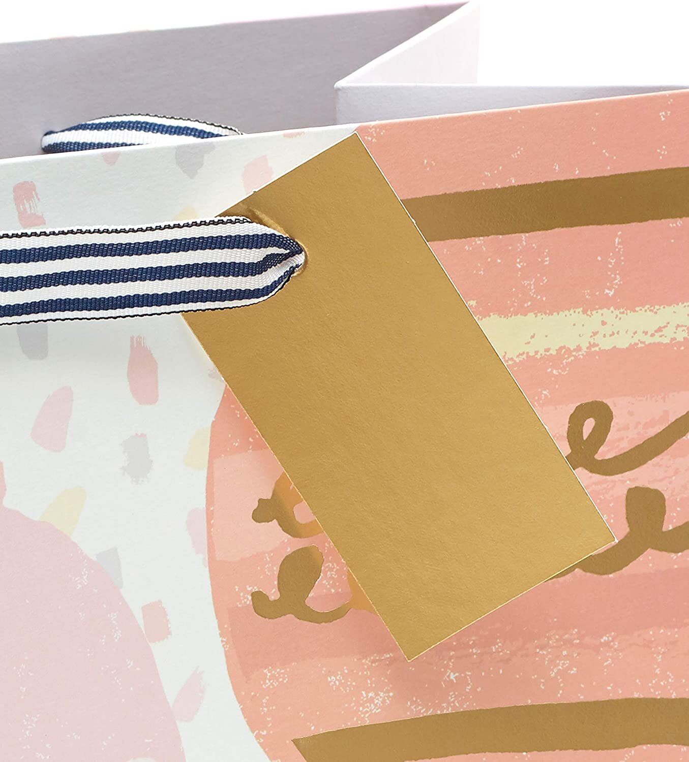 UK Greetings gold foil balloon design large birthday gift bag with festive print and sturdy handles for gift wrapping.