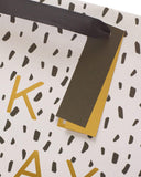 UK Greetings large gift bag with gold foil balloon design, perfect for special occasions, made of durable paper.