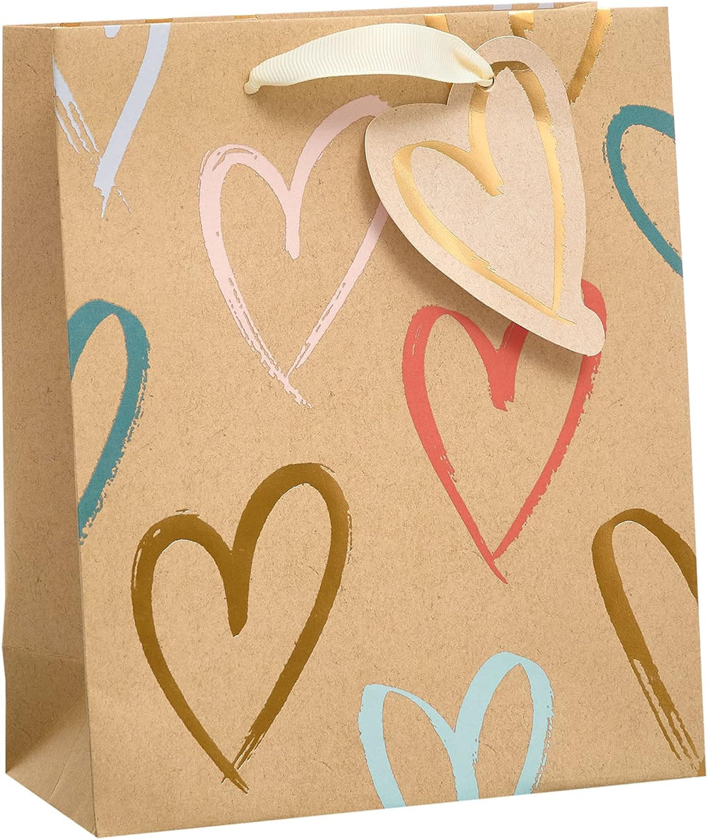 UK Greetings Kraft Hearts Design medium gift bag with pink heart pattern, perfect for gifting occasions.