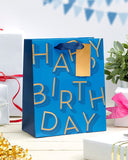 Blue UK Greetings medium gift bag for him, featuring a male-themed design, suitable for gifts in the gift bags and boxes category.