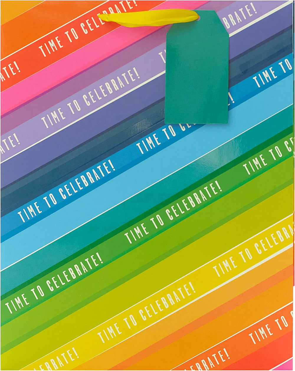 Colorful large UK Greetings gift bag with rainbow design, perfect for wrapping presents, featuring vibrant hues and sturdy handles.
