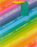 Colorful large UK Greetings gift bag with rainbow design, perfect for wrapping presents, featuring vibrant hues and sturdy handles.