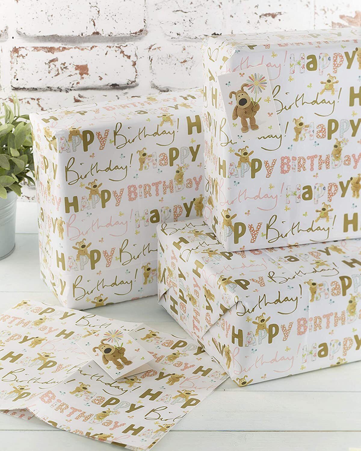 UK Greetings Boofle birthday gift wrap with matching tag featuring colorful Boofle design and festive birthday motifs.