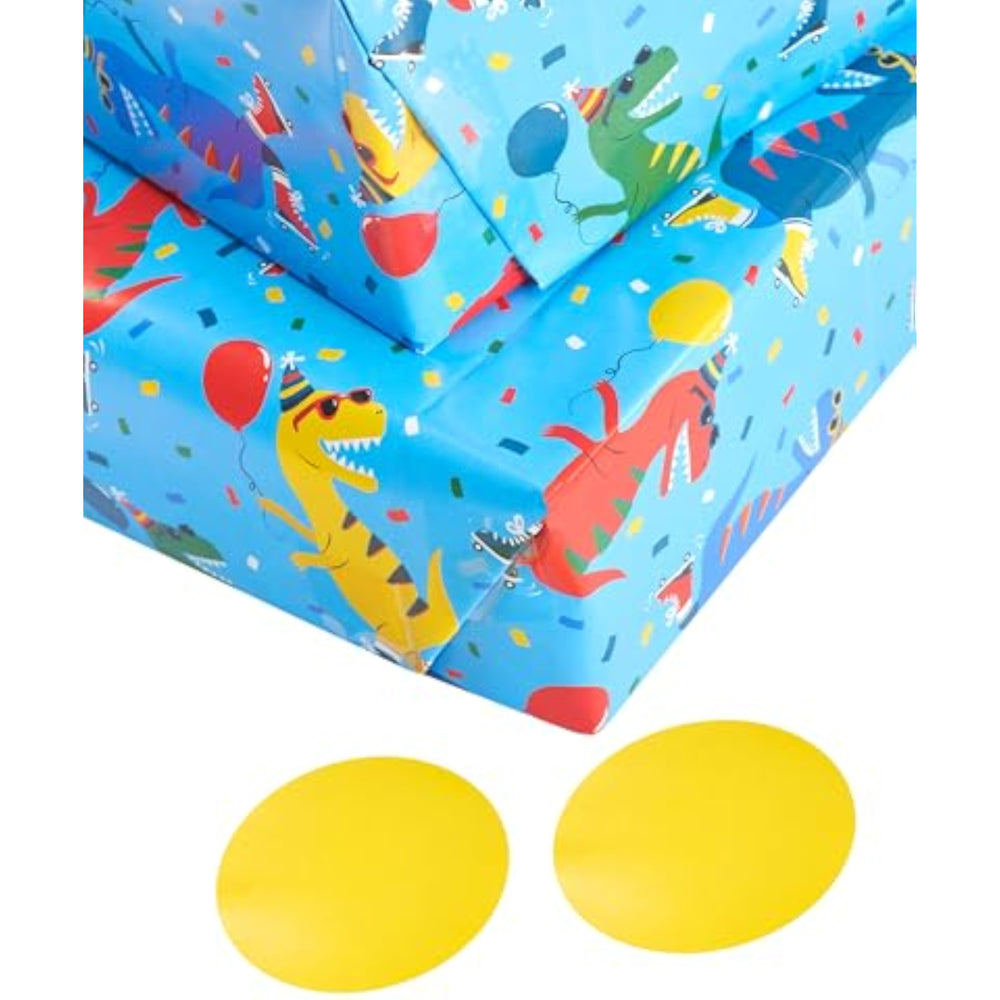 UK Greetings skating dinosaur gift wrap with vibrant dinosaur design on two sheets and two matching tags.