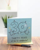 UK Greetings 30th birthday greeting card for him, her, or friends with a blue design, featuring celebratory graphics and festive details.