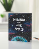UK Greetings Father's Day card for husband featuring Our World design, with colorful illustrations and heartfelt message inside.