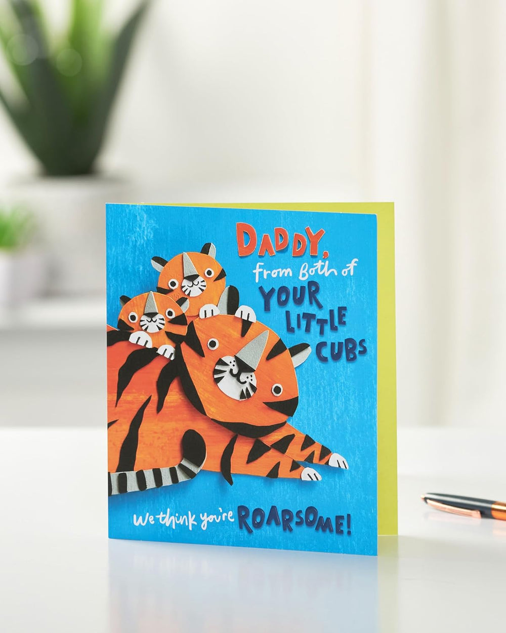 UK Greetings Father's Day greeting card featuring a Roarsome design for Daddy from Little Cubs, with colorful dinosaur illustrations.