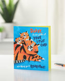 UK Greetings Father's Day greeting card featuring a Roarsome design for Daddy from Little Cubs, with colorful dinosaur illustrations.