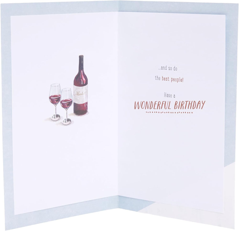 UK Greetings birthday greeting card featuring a watch and wine design, colorful illustration on a festive greeting card.