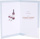 UK Greetings birthday greeting card featuring a watch and wine design, colorful illustration on a festive greeting card.