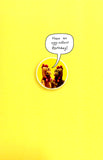 Funny birthday card for him featuring a humorous chicken joke, from UK Greetings, with a brown background and playful design.