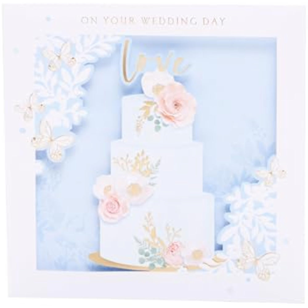 UK Greetings wedding greeting card with 3D cake design, featuring layered cake visuals and elegant wedding motifs.