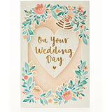 UK Greetings 3D pop-up floral wedding card showcasing a vibrant floral design and intricate wedding-themed pop-up elements.