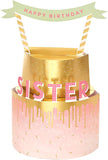 UK Greetings 3D pop-up sister birthday card featuring a colorful cake design and festive greeting details.