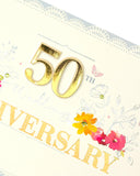 UK Greetings 50th Anniversary Card for Couples featuring gold glitter and decorative gem stones, with a romantic design.