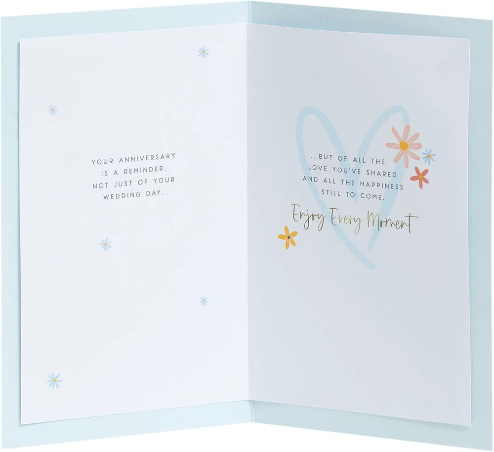 UK Greetings anniversary greeting card for him, her, or friends featuring a floral heart design and romantic message.