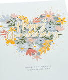 UK Greetings anniversary greeting card with floral heart design, suitable for him, her, or friends, featuring elegant floral artwork.
