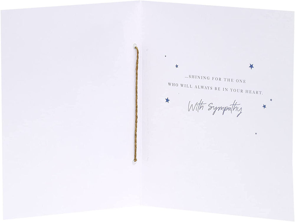 UK Greetings sympathy greeting card featuring a gold foil design with a starry sky, conveying heartfelt condolences.