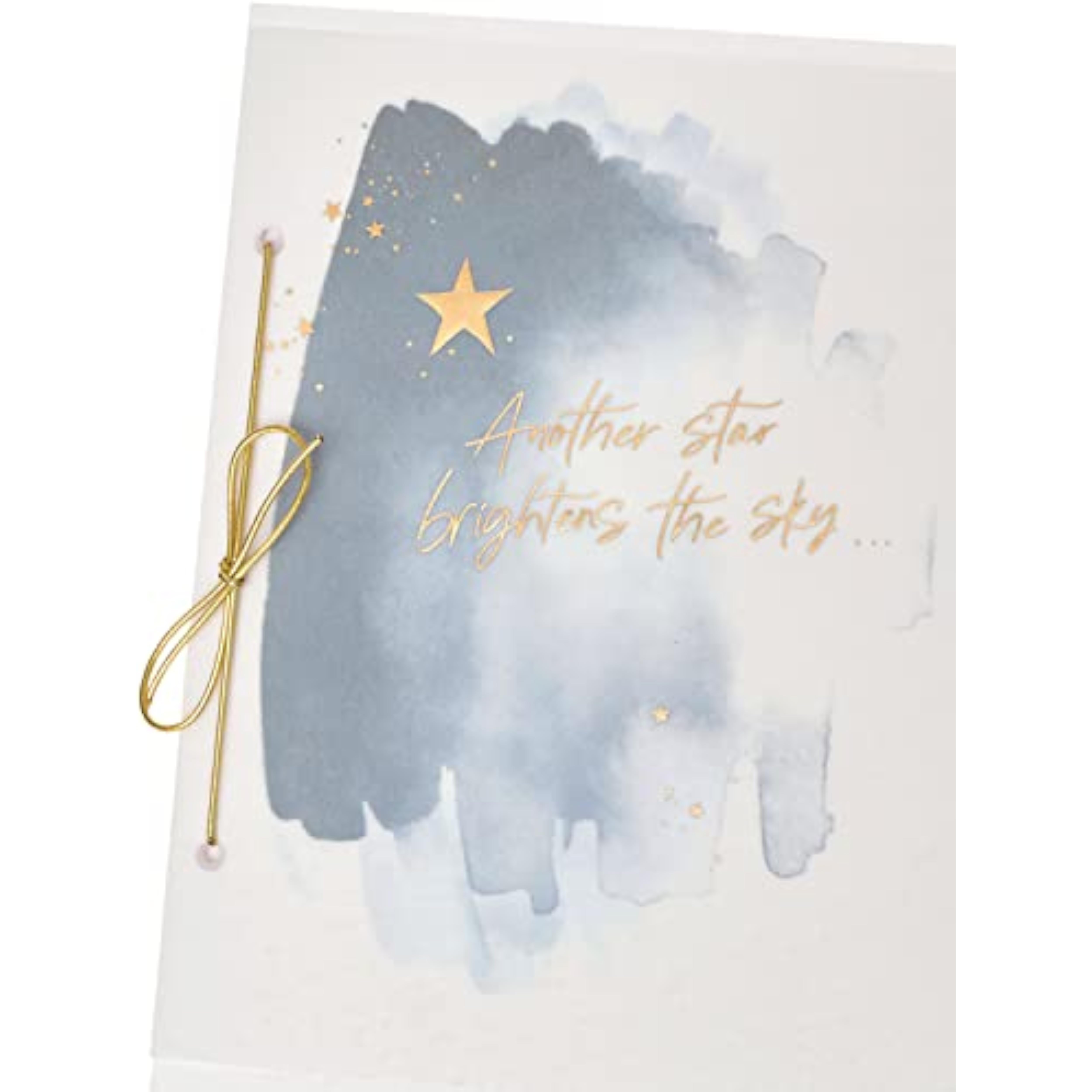 UK Greetings sympathy greeting card featuring gold foil star design and heartfelt message, designed to express comfort and support.