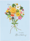UK Greetings birthday greeting card featuring a beautiful floral posy design with vibrant flowers and elegant lettering.