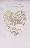UK Greetings wedding day greeting card featuring a beautiful swan design with silver foil finishes, elegant and suitable for weddings.