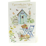 UK Greetings birthday card featuring colorful floral design, perfect for celebrating birthdays with a cheerful greeting.