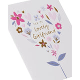 UK Greetings birthday card for girlfriend featuring a flower heart design, with colorful floral and heart illustrations.