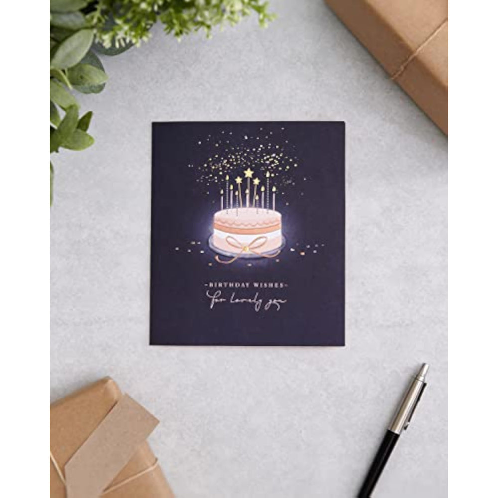 UK Greetings birthday card for her featuring a starry cake design, with an envelope, perfect for female friends.