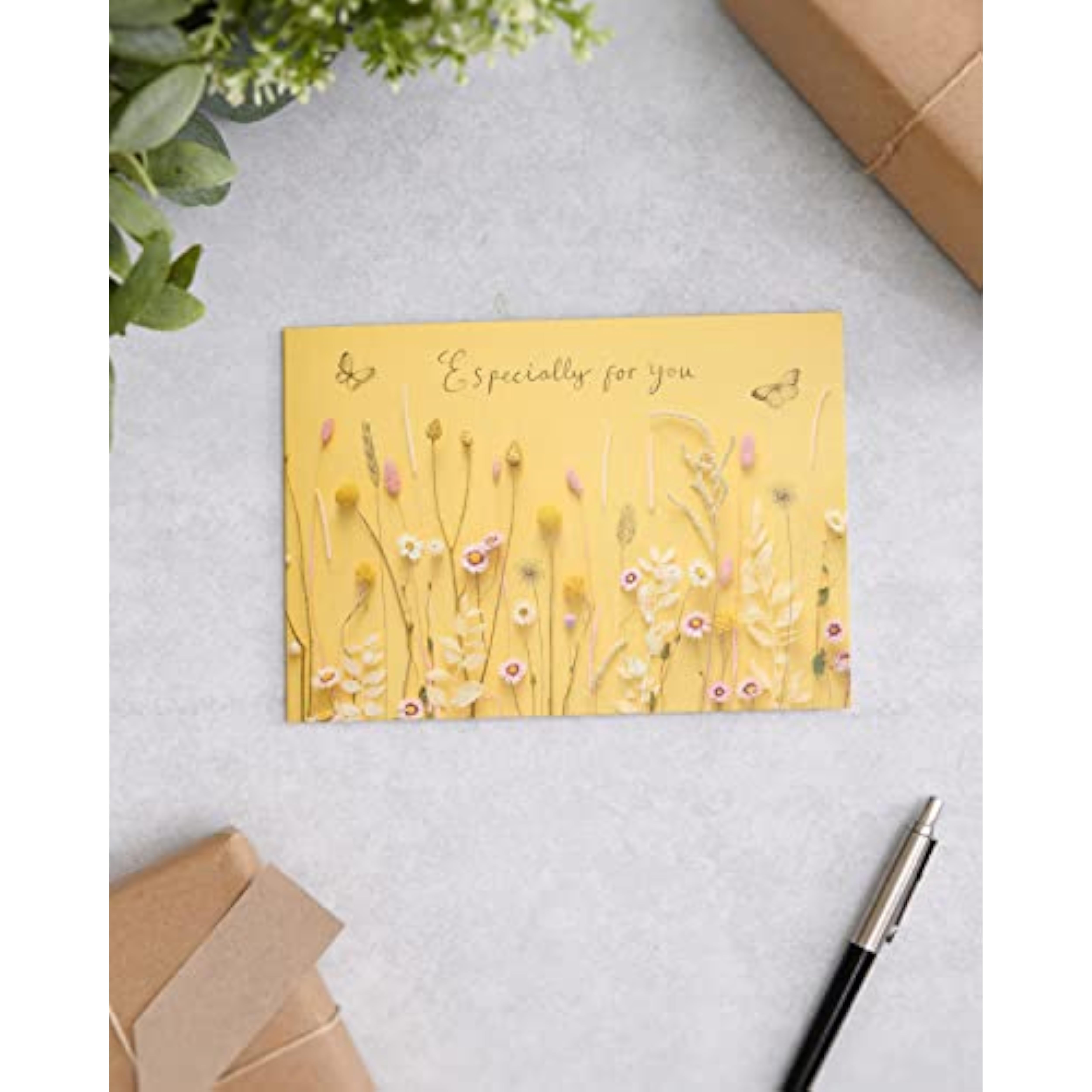 UK Greetings birthday card for her featuring a warm flower design, comes with an envelope, ideal for female friends.
