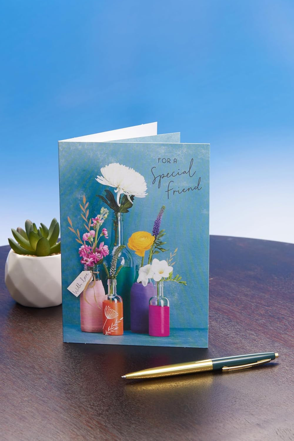 UK Greetings birthday card for her featuring a floral bouquet in a vase, perfect for friends and special occasions.