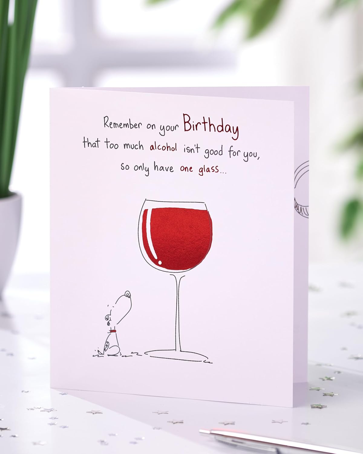 UK Greetings birthday card for her featuring a humorous wine design, perfect for friends celebrating special occasions.
