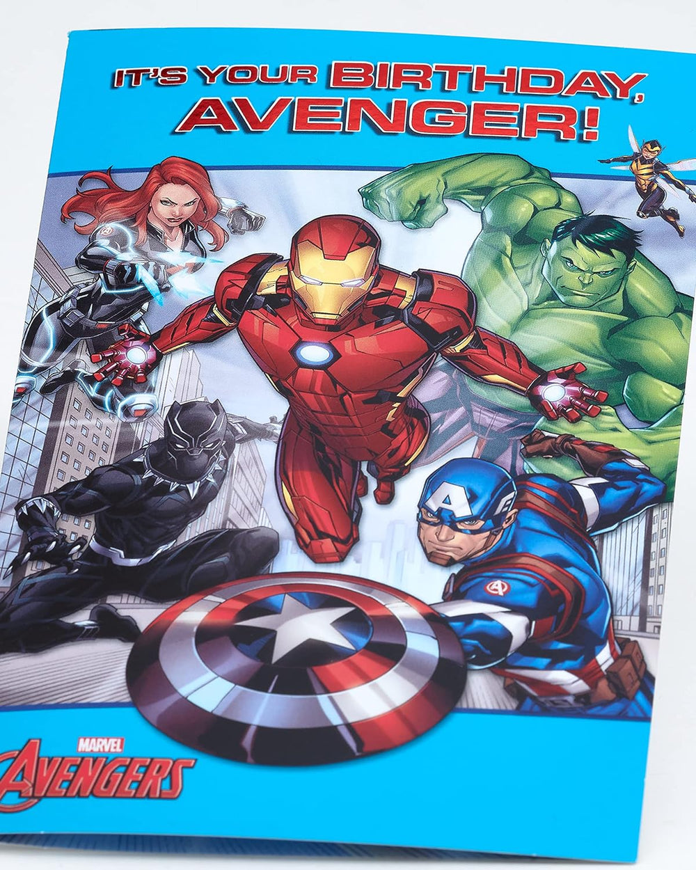 Colorful Avengers design UK Greetings birthday card for him or boy with envelope, featuring superhero characters and vibrant illustrations.