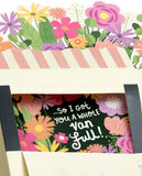 UK Greetings birthday card for mum featuring a pop-up flower truck design with colorful, detailed illustrations.