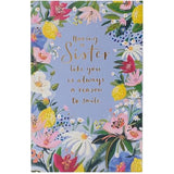 UK Greetings birthday card for sister featuring a floral border design, perfect for celebrating special occasions with a loved one.