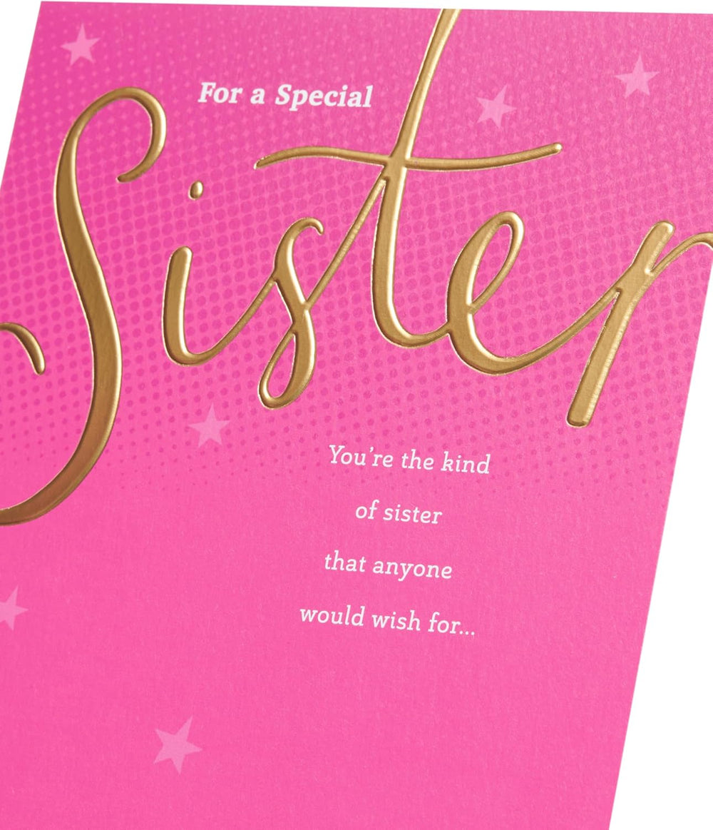 UK Greetings birthday card for sister featuring a pink and gold design, showcasing a festive greeting card with elegant details.