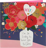 UK Greetings birthday card for wife featuring a vase with a colorful bouquet design, ideal for celebrating special occasions.