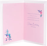 UK Greetings Champagne Design Sister Birthday Card, colorful greeting card with celebratory champagne illustration and floral accents.