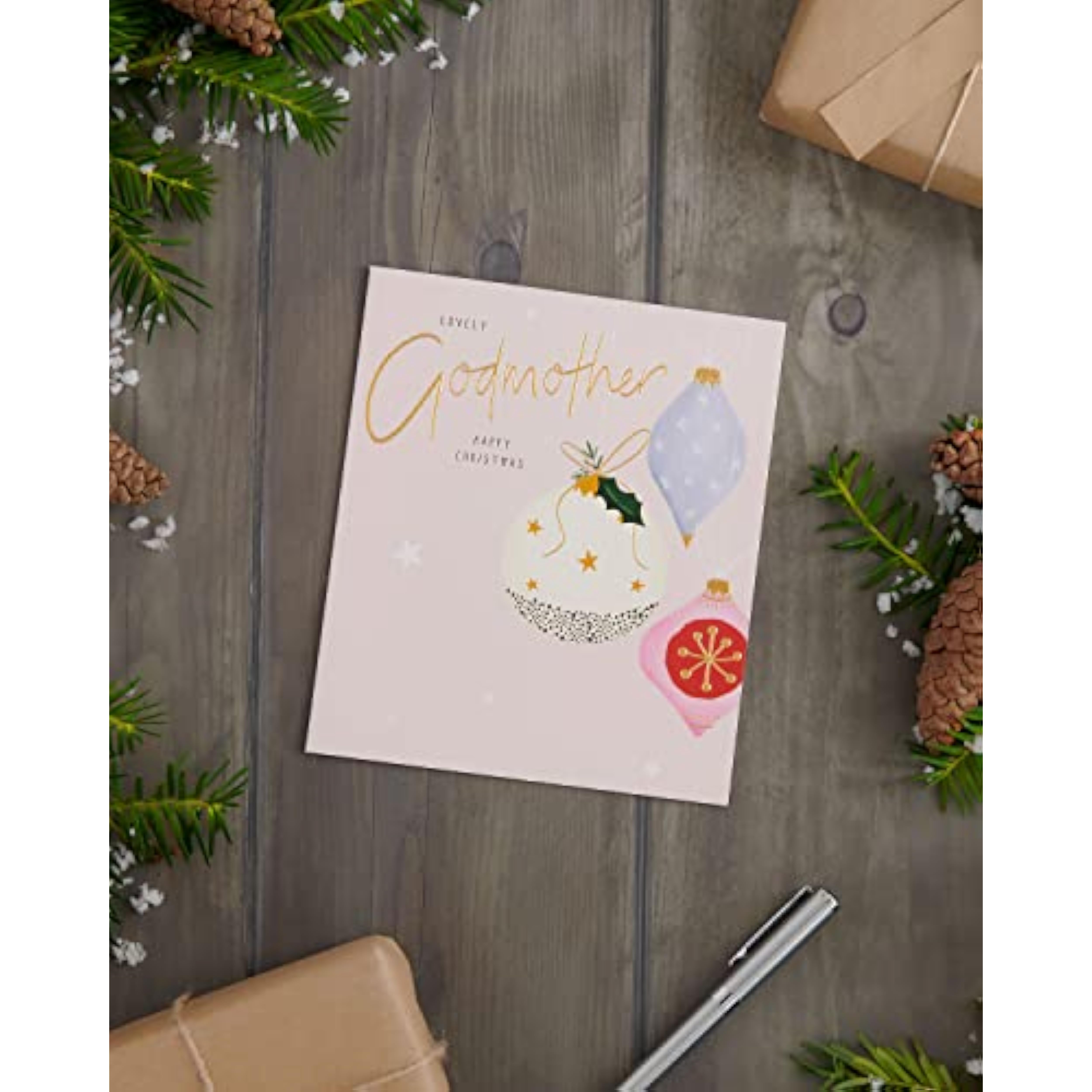 UK Greetings Christmas card for godmother featuring a festive baubles design, with colorful holiday decorations.