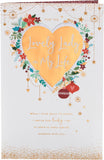 UK Greetings Christmas card for her with a gold heart design, featuring festive greeting card imagery for the holiday season.