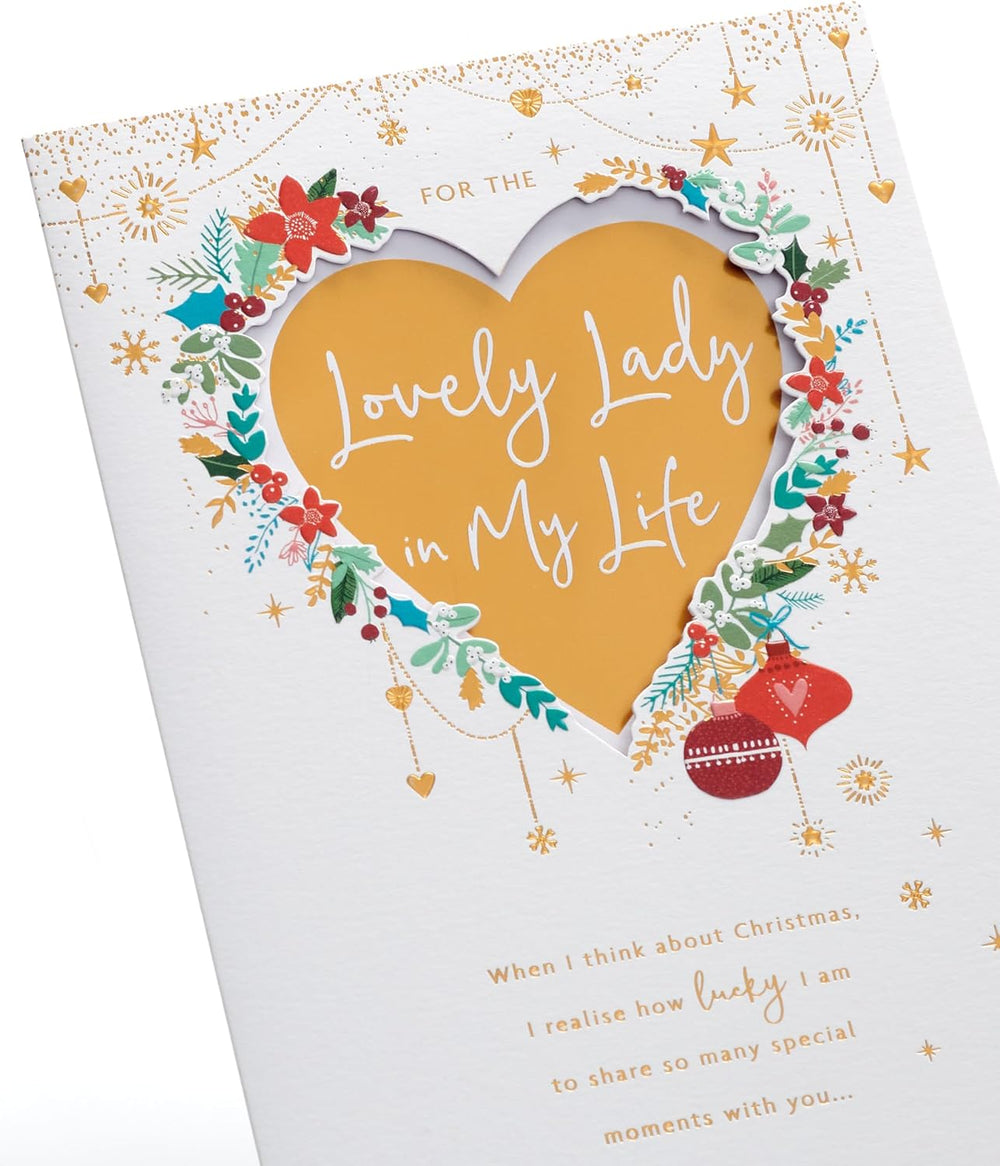 UK Greetings Christmas card for her with gold heart design, featuring festive holiday imagery and elegant lettering.