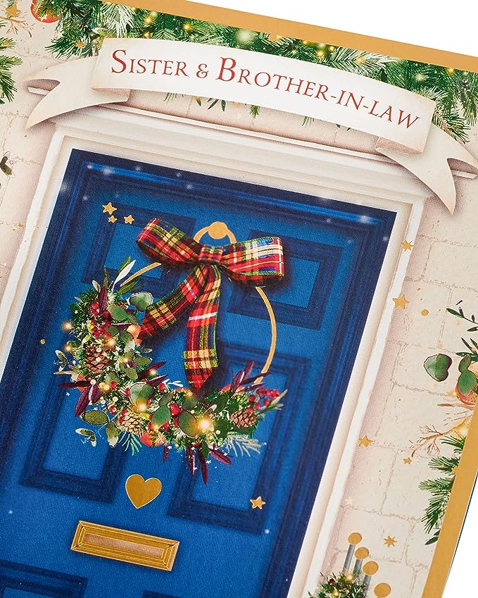 UK Greetings Christmas card for sister and brother-in-law featuring a blue door design, perfect for holiday greetings.